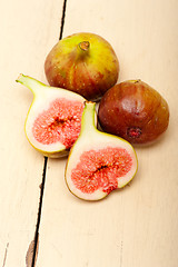 Image showing fresh figs on a rustic table