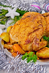 Image showing Chicken Christmas with vegetables and silver tinsel