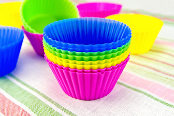 Image showing Molds for cupcakes on fabric