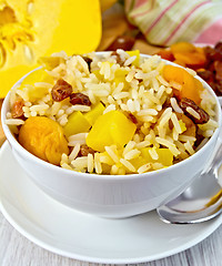 Image showing Pilaf fruit with pumpkin on board