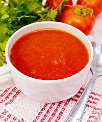 Image showing Soup tomato on napkin with spoon