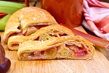 Image showing Strudel with rhubarb and mug on board