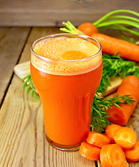 Image showing Juice carrot with leaf on board