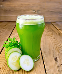 Image showing Juice cucumber in glass on board