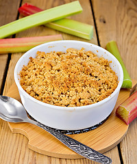 Image showing Crumble with rhubarb on board