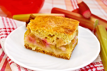 Image showing Pie rhubarb on napkin with drink