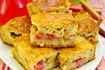 Image showing Pie rhubarb and drink on linen tablecloth