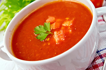 Image showing Soup tomato on napkin with parsley