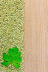 Image showing Lentils green on board on the left with parsley