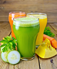 Image showing Juice vegetable in three glasses with vegetables on board