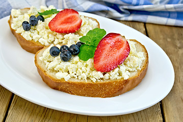 Image showing Bread with curd and berries in plate on board