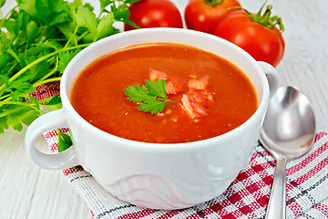 Image showing Soup tomato on napkin with pieces on board