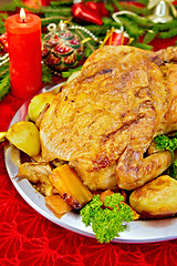 Image showing Chicken Christmas with toys and candles on tablecloth