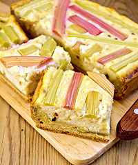 Image showing Pie with curd and rhubarb on board