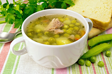Image showing Soup from green peas with meat on napkin