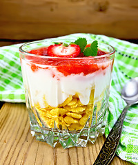 Image showing Dessert milk with strawberry and flakes in glass on board