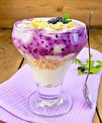 Image showing Dessert milk with blueberries on napkin