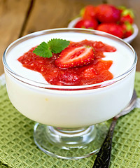 Image showing Dessert milk with strawberry in goblet on napkin