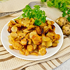 Image showing Jerusalem artichokes fried in dish on napkin