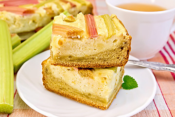 Image showing Pie with curd and rhubarb on tablecloth