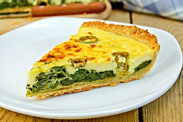 Image showing Pie with spinach and cheese in plate on table