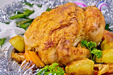 Image showing Chicken Christmas with vegetables and silver toys