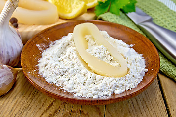 Image showing Calamari ring in flour on board