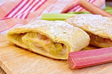 Image showing Strudel with rhubarb on linen tablecloth