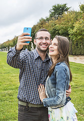 Image showing Happy Couple taking a selfie in a French Garden