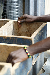 Image showing Hands of a Ghanaian at a shop