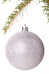 Image showing Christmas ball hanging from a branch of a fir tree