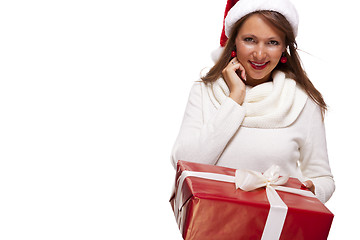 Image showing Pretty woman in a Santa hat with a large gift