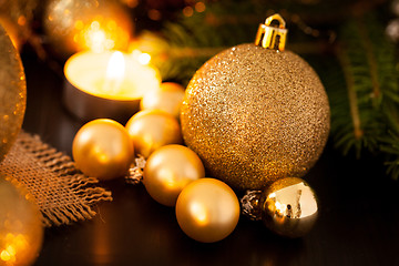 Image showing Warm gold and red Christmas candlelight background