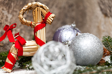 Image showing Silver Christmas bauble on a tree with snow