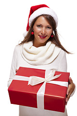 Image showing Pretty woman in a Santa hat with a large gift