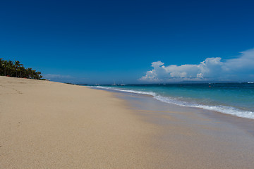 Image showing Beautiful tropical beach with lush vegetation