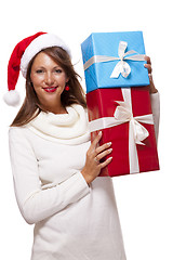 Image showing Vivacious woman in a Santa hat celebrating Xmas