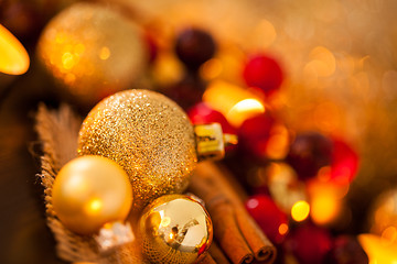 Image showing Warm gold and red Christmas candlelight background