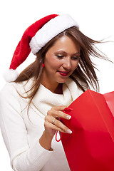 Image showing Happy vivacious Christmas shopper