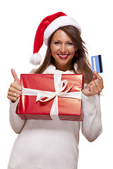 Image showing Smiling woman purchasing Christmas gifts