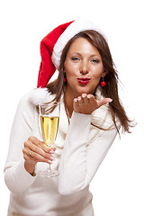 Image showing Playful woman celebrating Xmas blowing a kiss