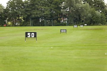 Image showing Empty Golf Ball Baskets at Driving Range