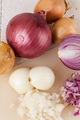 Image showing Whole, peeled and diced brown onion