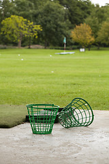 Image showing Empty Golf Ball Baskets at Driving Range