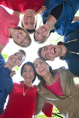 Image showing young friends staying together outdoor in the park