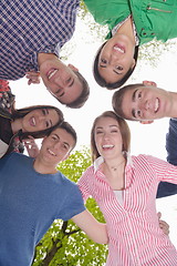 Image showing young friends staying together outdoor in the park