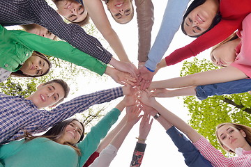 Image showing young friends staying together outdoor in the park