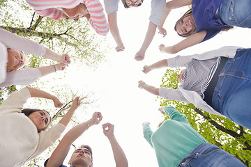 Image showing young friends staying together outdoor in the park