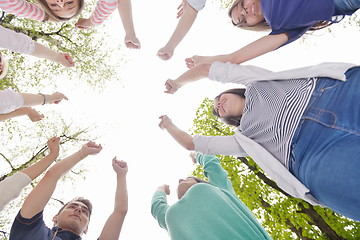 Image showing young friends staying together outdoor in the park