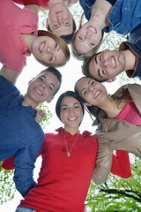 Image showing young friends staying together outdoor in the park